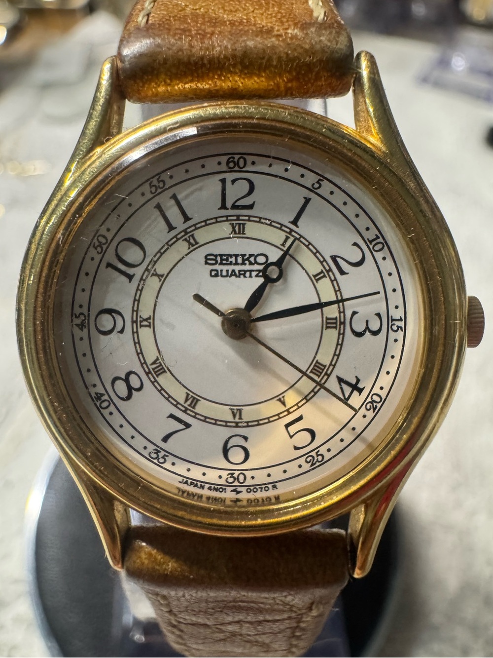 Seiko Gold Tone Case with White Dial and Brown Leather Strap